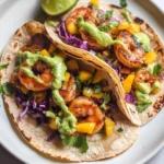 Spicy Shrimp Tacos with Mango Slaw and Avocado Crema